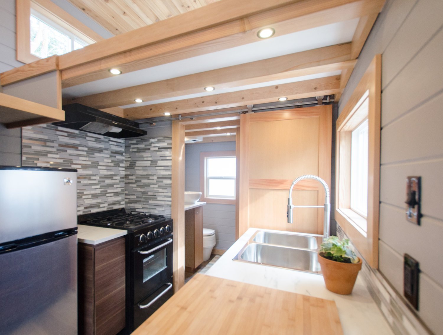 24’ “Blue Heron” Tiny House on Wheels by Rewild Homes